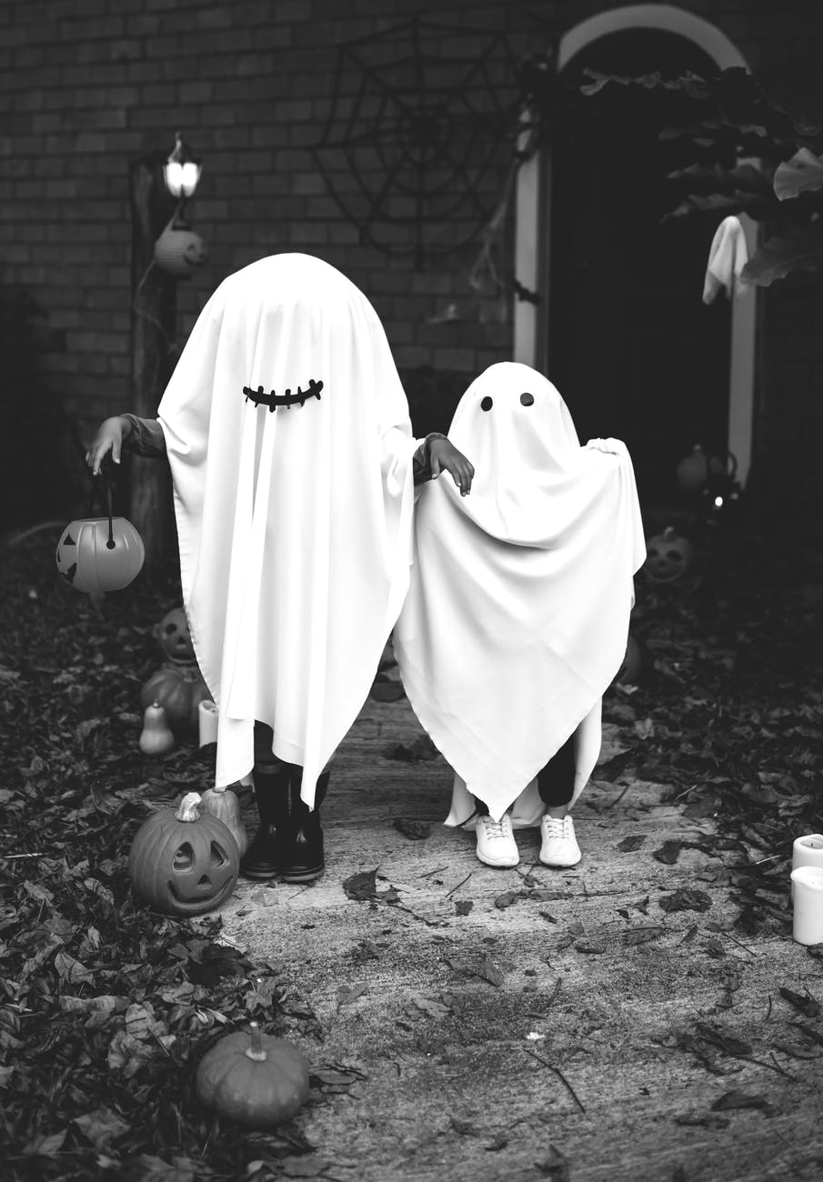 two people dressed as ghost